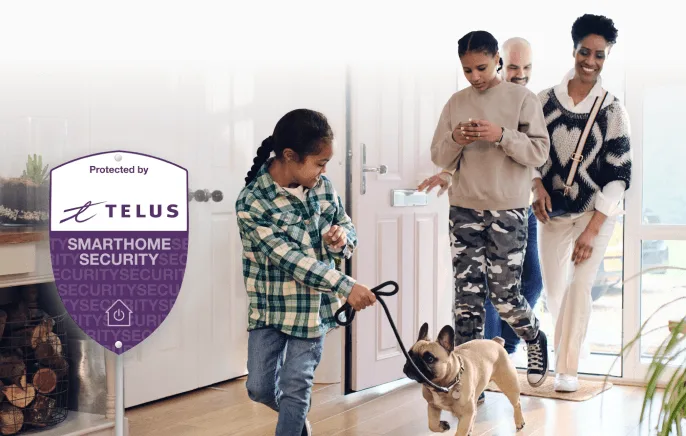 Child in plaid shirt leading small dog into modern home with family members and TELUS security sign visible