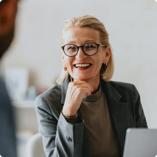Professional woman consulting another person with her laptop
