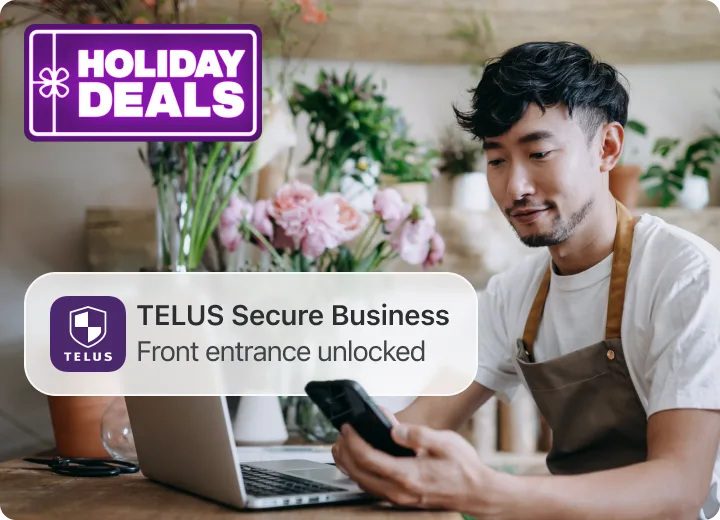 Shop owner checks phone; TELUS alert overlay reads “Person Detected — Front entrance”. A badge reading “Holiday Deals”