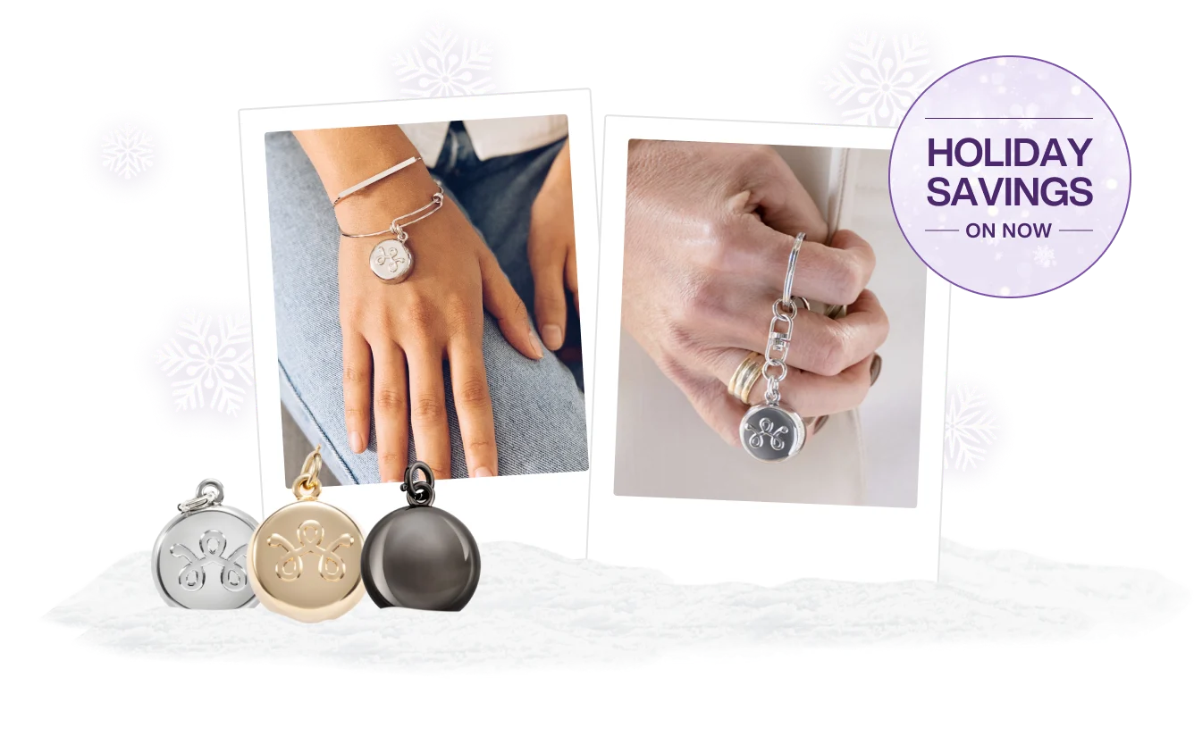 Three SmartWear Security charms next to two close ups of individuals holding a stylish device. A roundel on the right reads “Holiday Savings on now”.