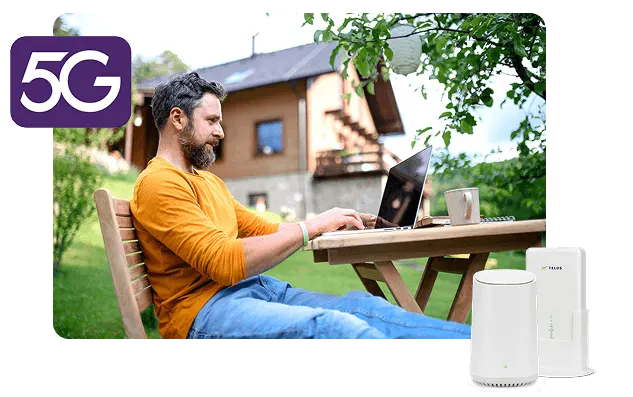 A woman sitting outdoors on a patio with a laptop, alongside TELUS Wireless Home Internet 5G hardware.
