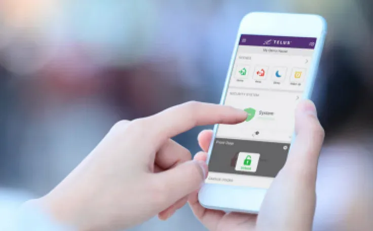 Shows a pair of hands holding a smart phone device with the TELUS SmartHome Security app.