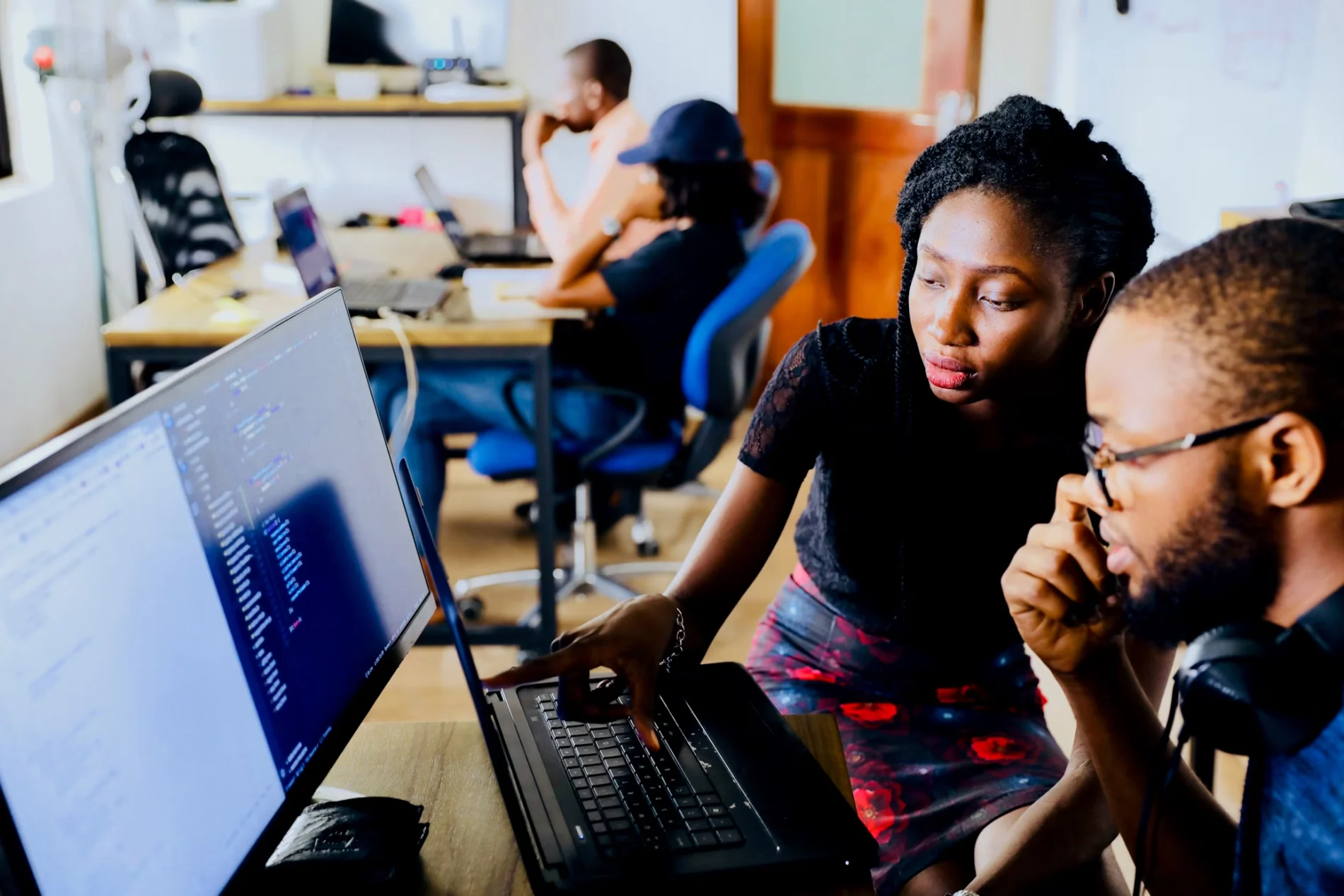 Woman and man sitting at a computer