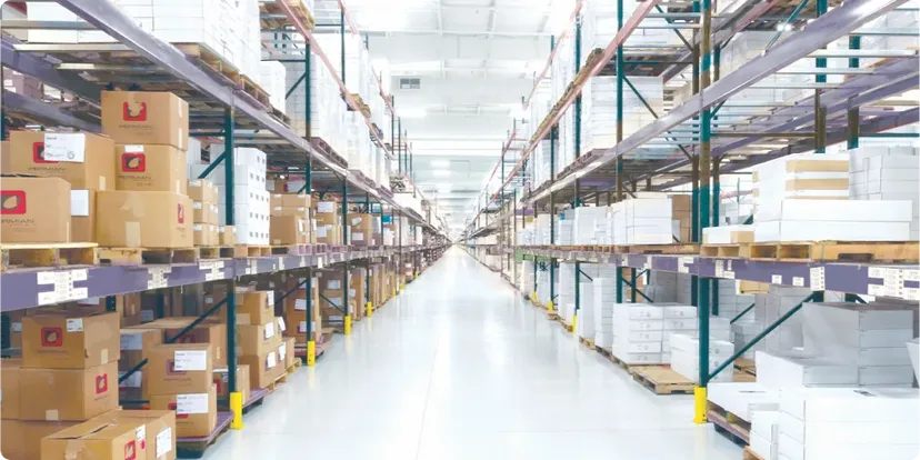 Warehouse interior with rows of shelved boxes