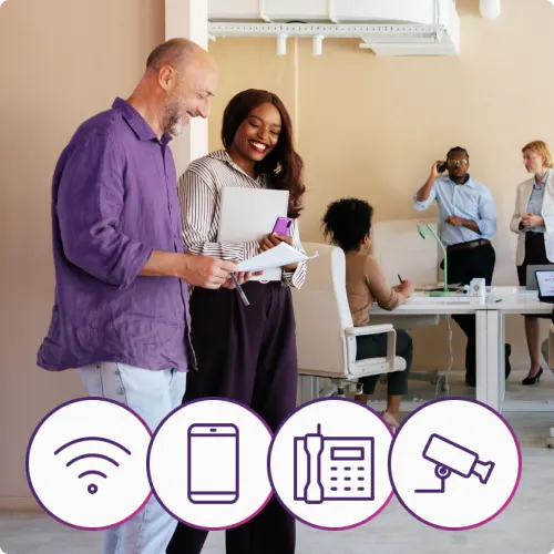 Business owner on a laptop; purple icons for Wi-Fi, mobile, phone and security camera, promoting bundles.