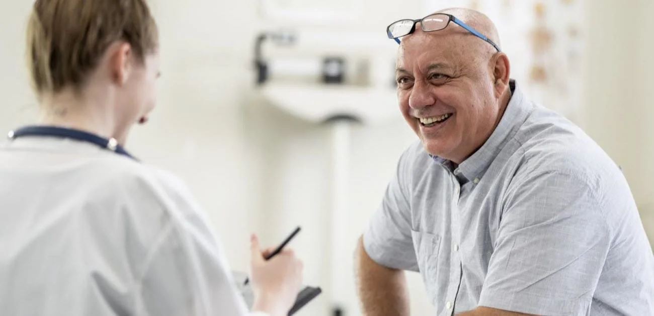 Healthcare worker speaking to patient