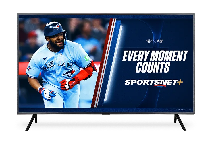 A TV displays the poster for Sportsnet+ featuring the Blue Jays baseball with the slogan "EVERY MOMENT COUNTS".