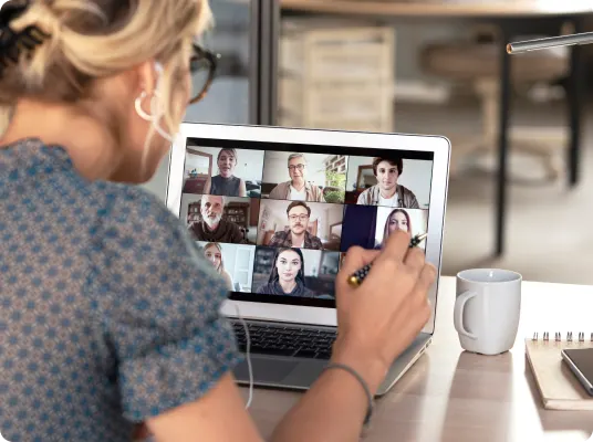 A woman taking a video meeting from a tablet.