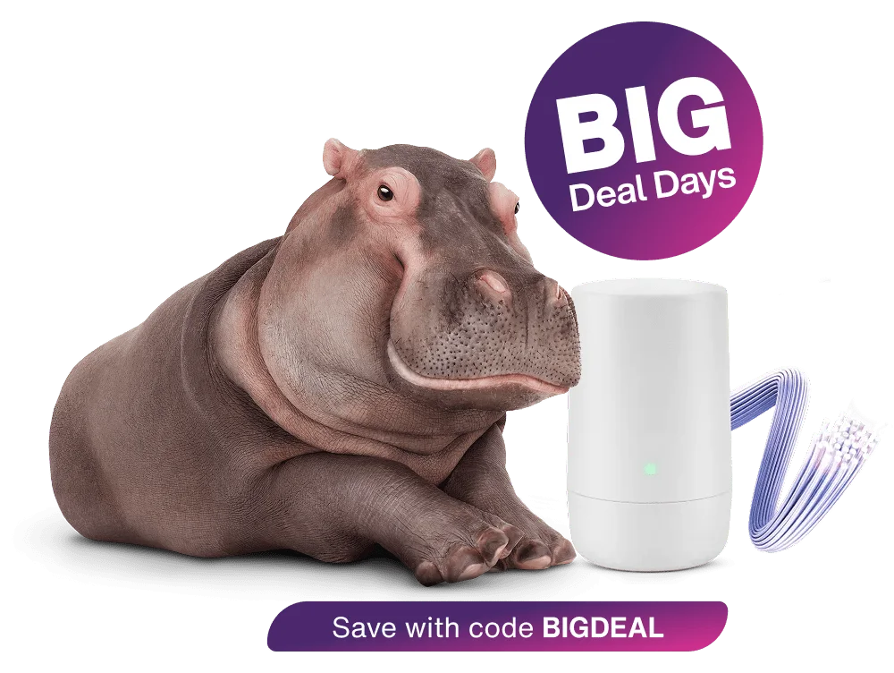 A hippo sitting next to a TELUS modem. A roundel above reads: Big Deal Days. Save with code BIGDEAL.