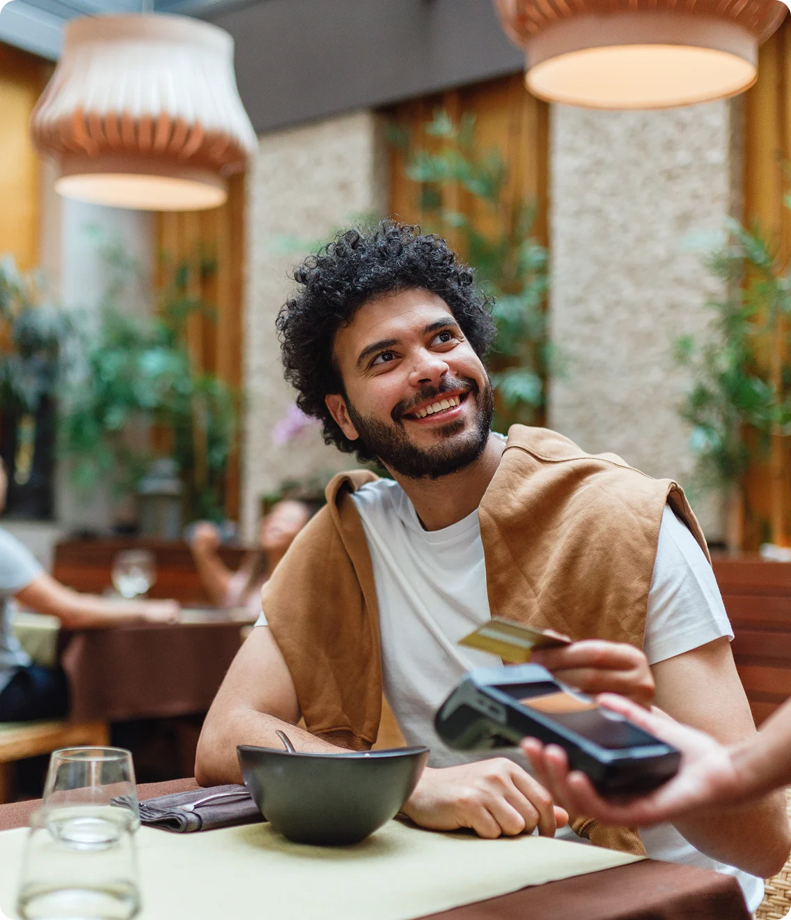 Happy customer receiving priority service from restaurant staff in modern dining setting