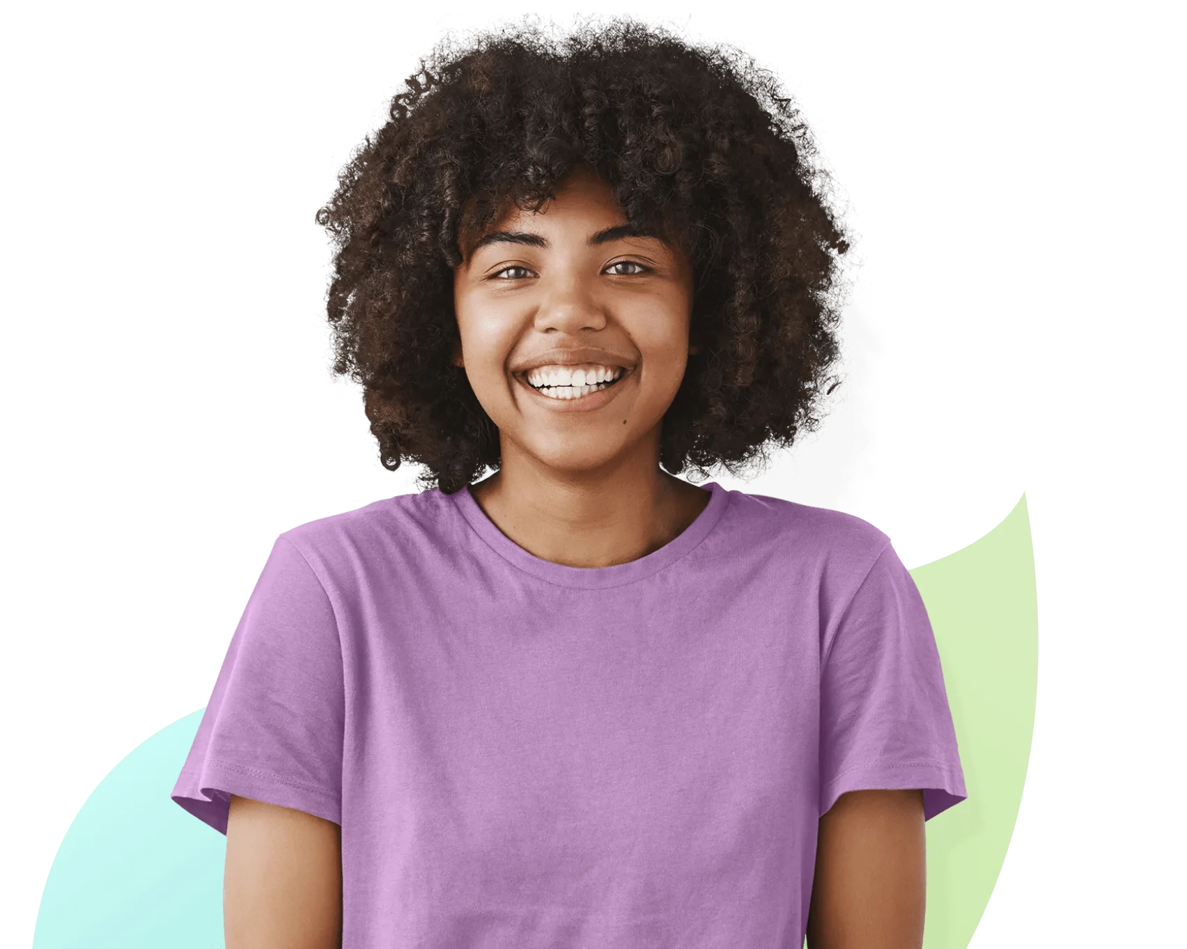 A young girl in a purple t-shirt looking straight ahead and smiling.