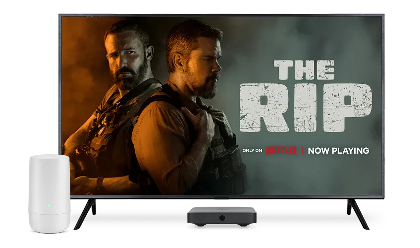 A TV, digital box and TELUS modem. The TV screen displays the poster for The Rip.
