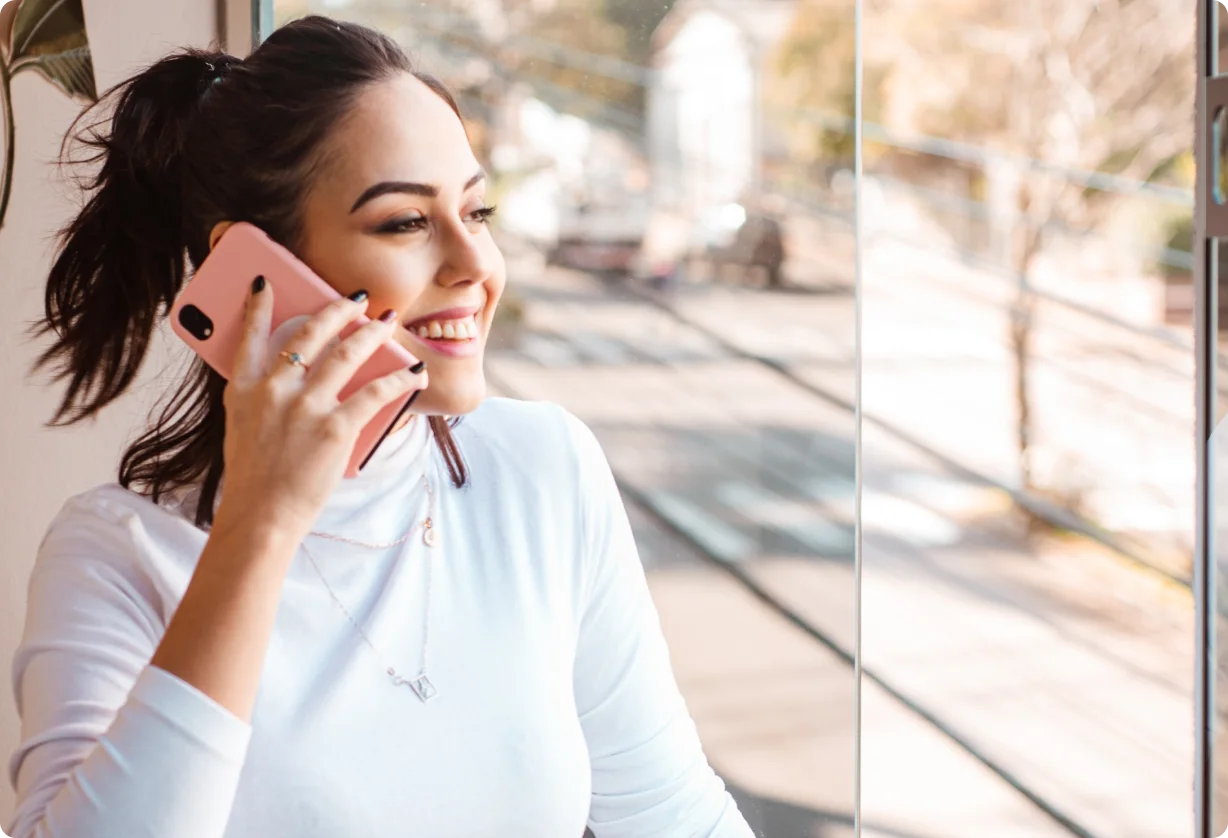 Woman talking on a smartphone outdoors.