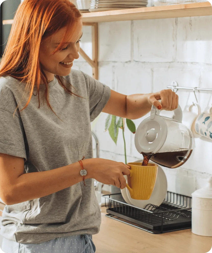 Woman pouring coffee in kitchen with smart home voice command overlay