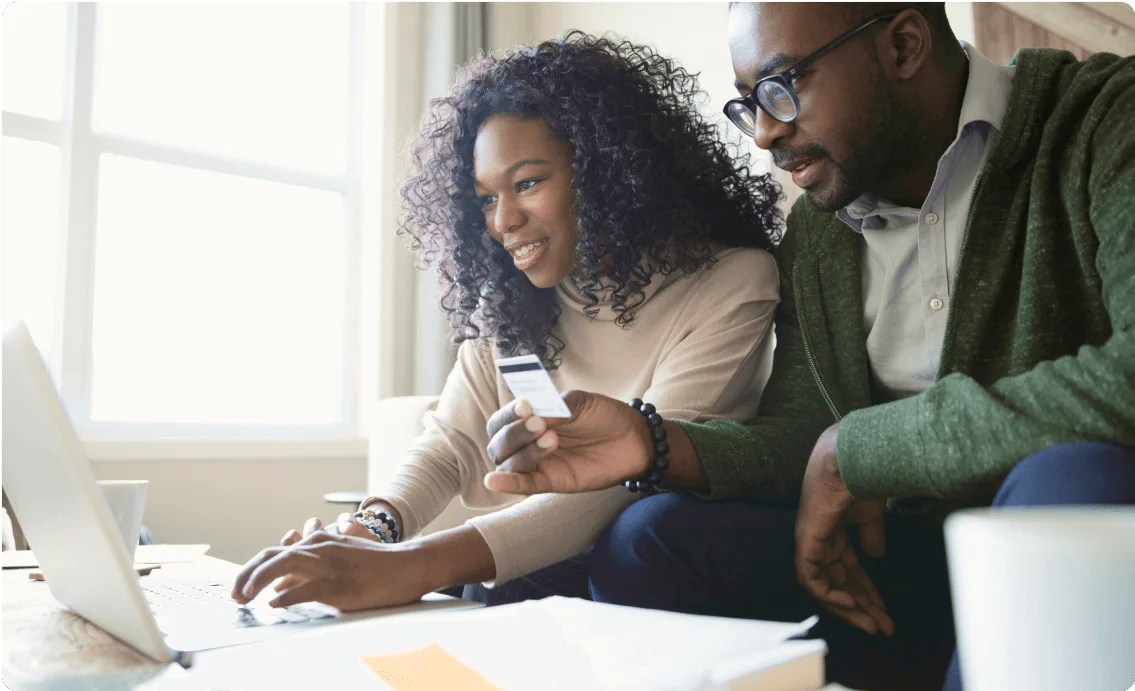 A couple checks the status of their investments online.