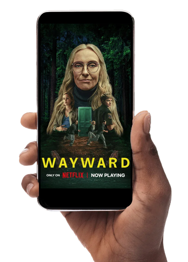 A hand holds a smartphone with the screen displaying Netflix’s 2025 film Wayward.