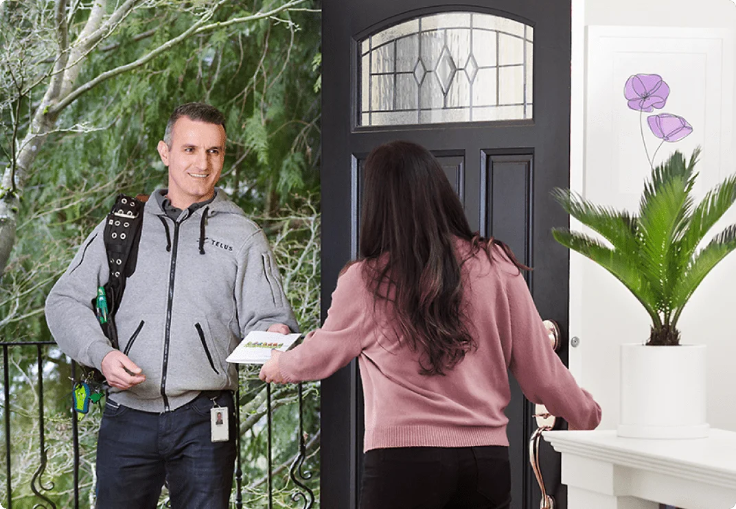 An image showing a TELUS tech visits a customer at home.
