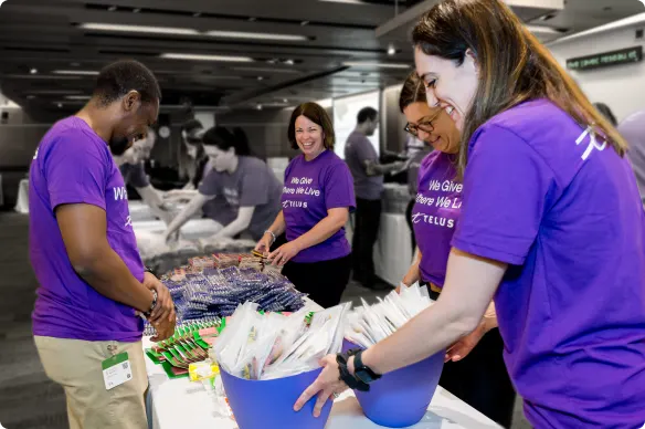 TELUS team members packing school supplies for Kits for Kids.