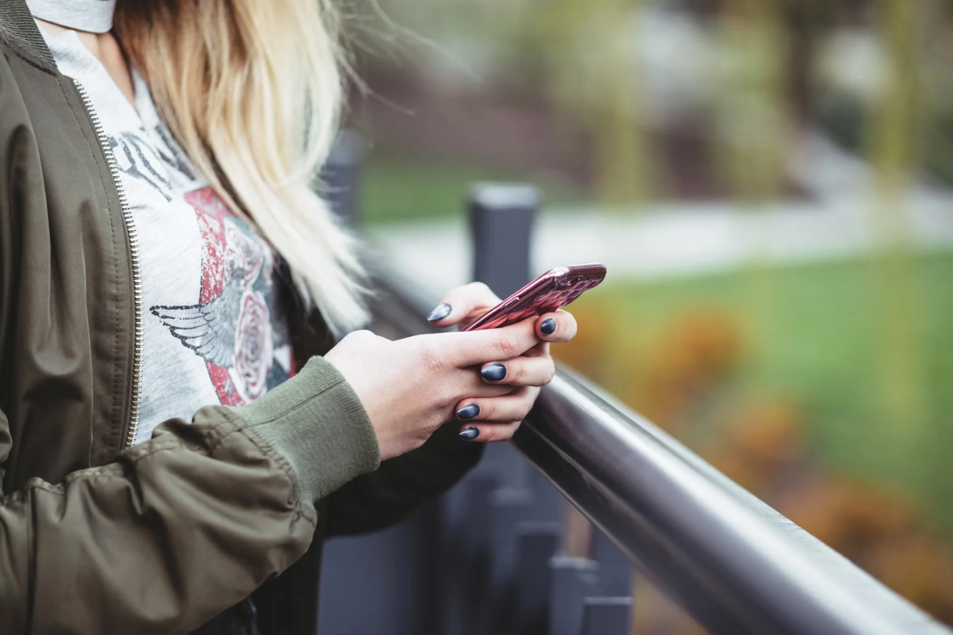 Woman holding cellphone in her hands