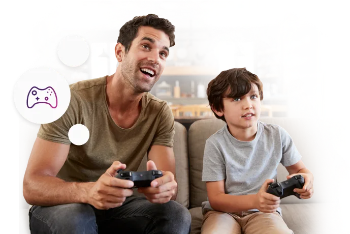 A man and child playing a video game together