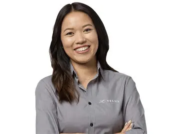 A smiling TELUS employee