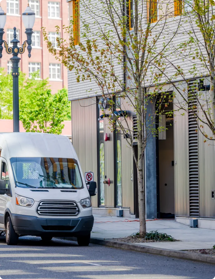 White van parked on street to make a delivery