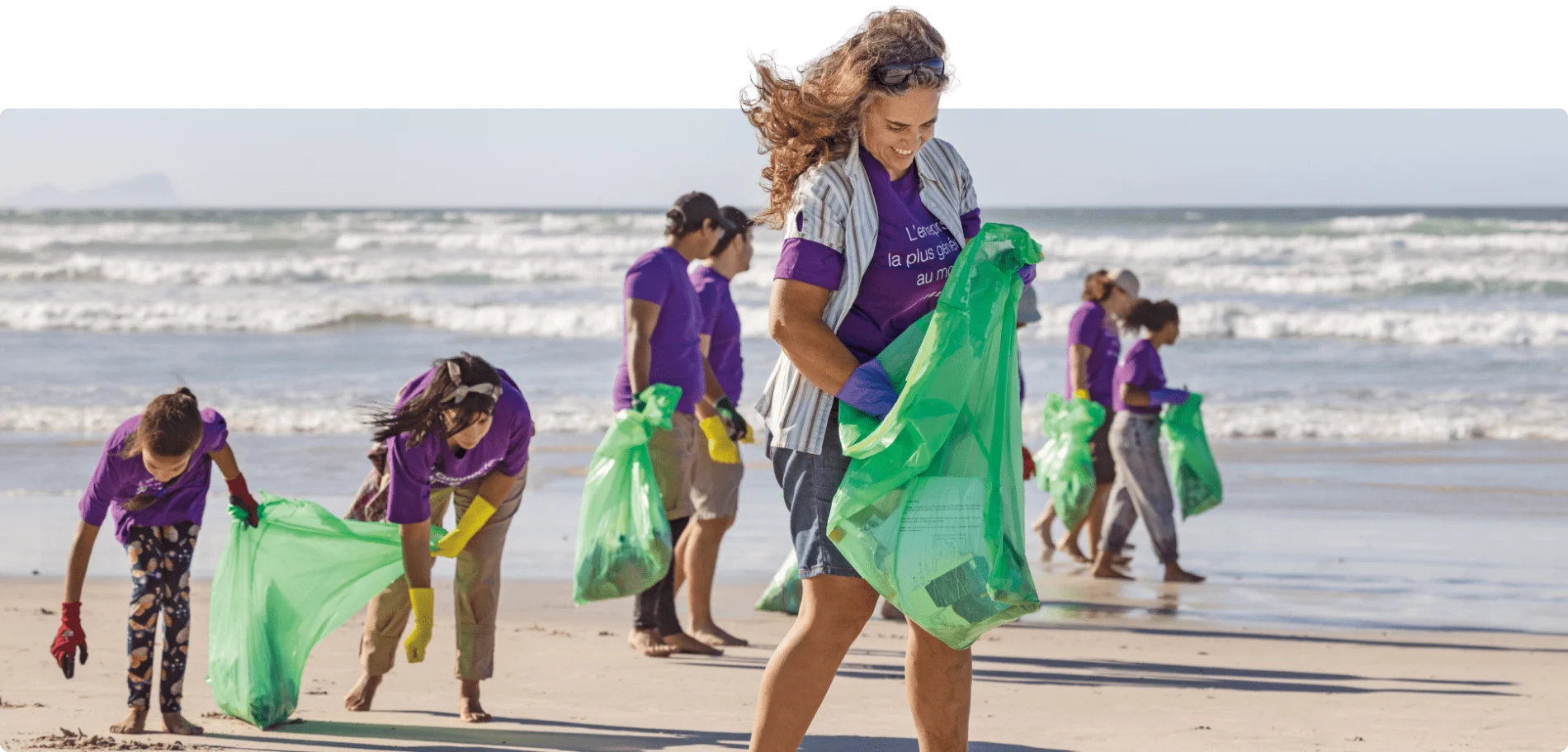 TELUS team member volunteers cleaning up a beach