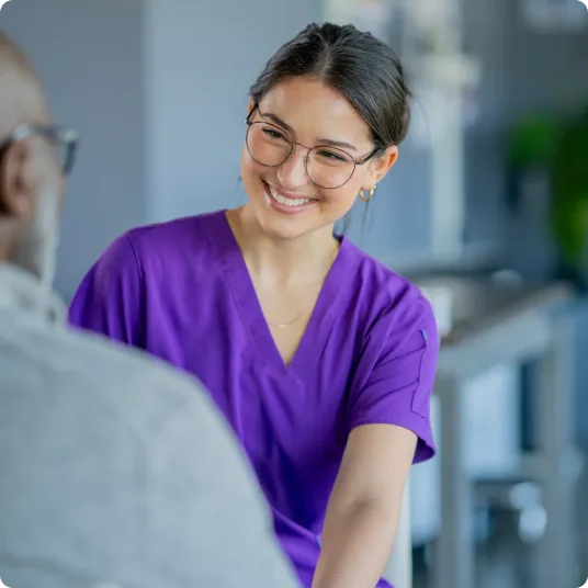 Allied health care professional consulting a patient