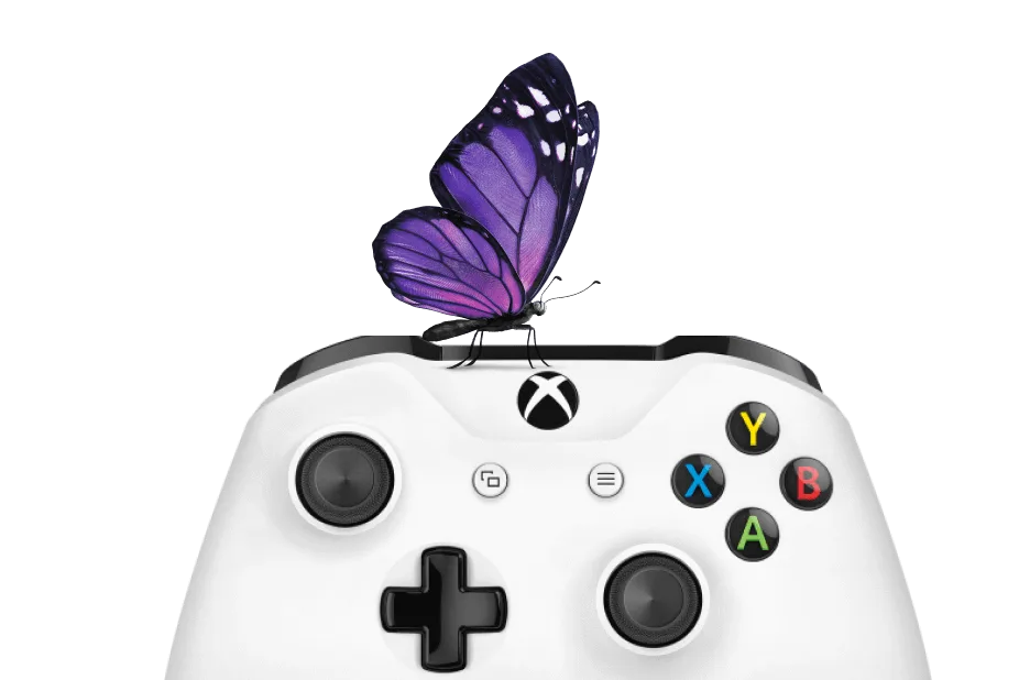 A butterfly rests on an XBOX game controller.