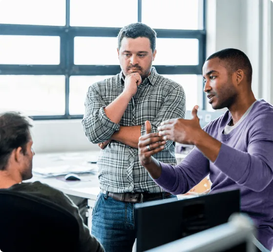 Team of professionals collaborating in a modern office, illustrating seamless connectivity and real-time communication enabled by a reliable managed network.