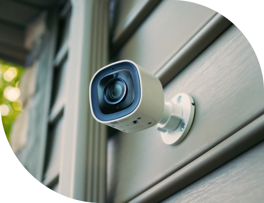 Outdoor Wi-Fi Security Camera  installed on the side of a house