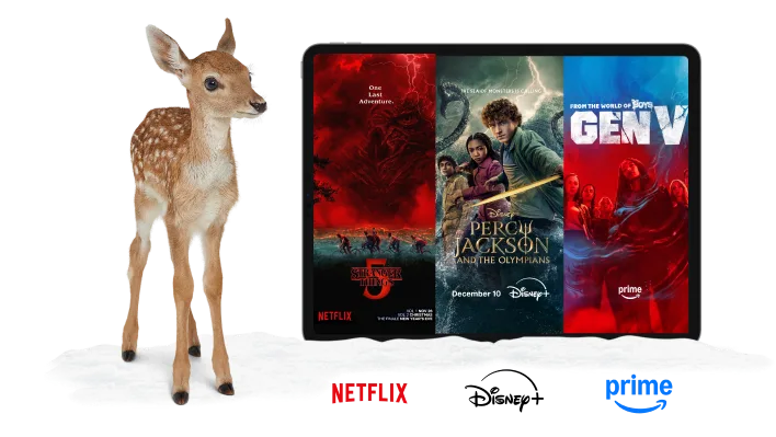 A deer standing next to a tablet. The tablet displays posters for Wednesday, The Lowdown and Gen V. Under the tablet are logos of Netflix, Disney+ and Amazon Prime.
