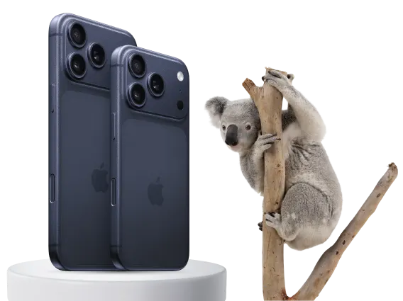 The back view of iPhone Pro and Pro Max in Deep Blue next to a koala bear sitting on a tree branch.