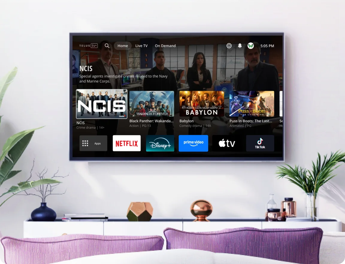 A large TV hangs on a wall displaying the Optik interface