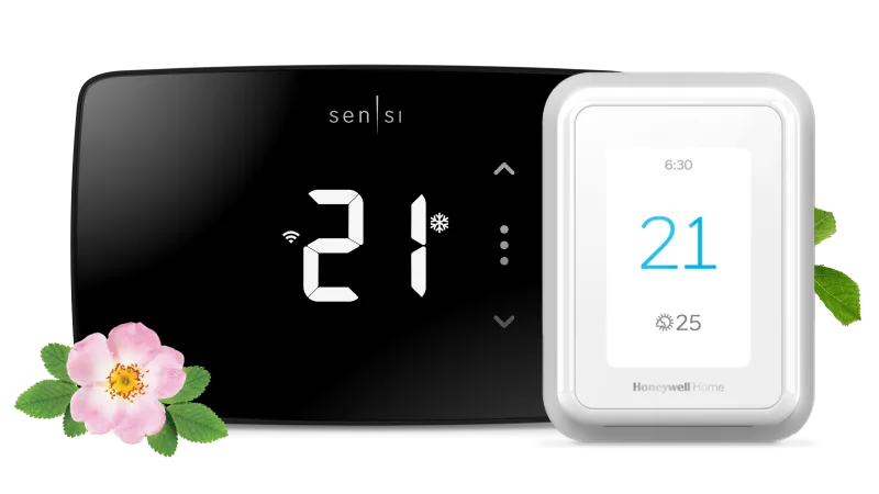 A black and a white smart thermostat.