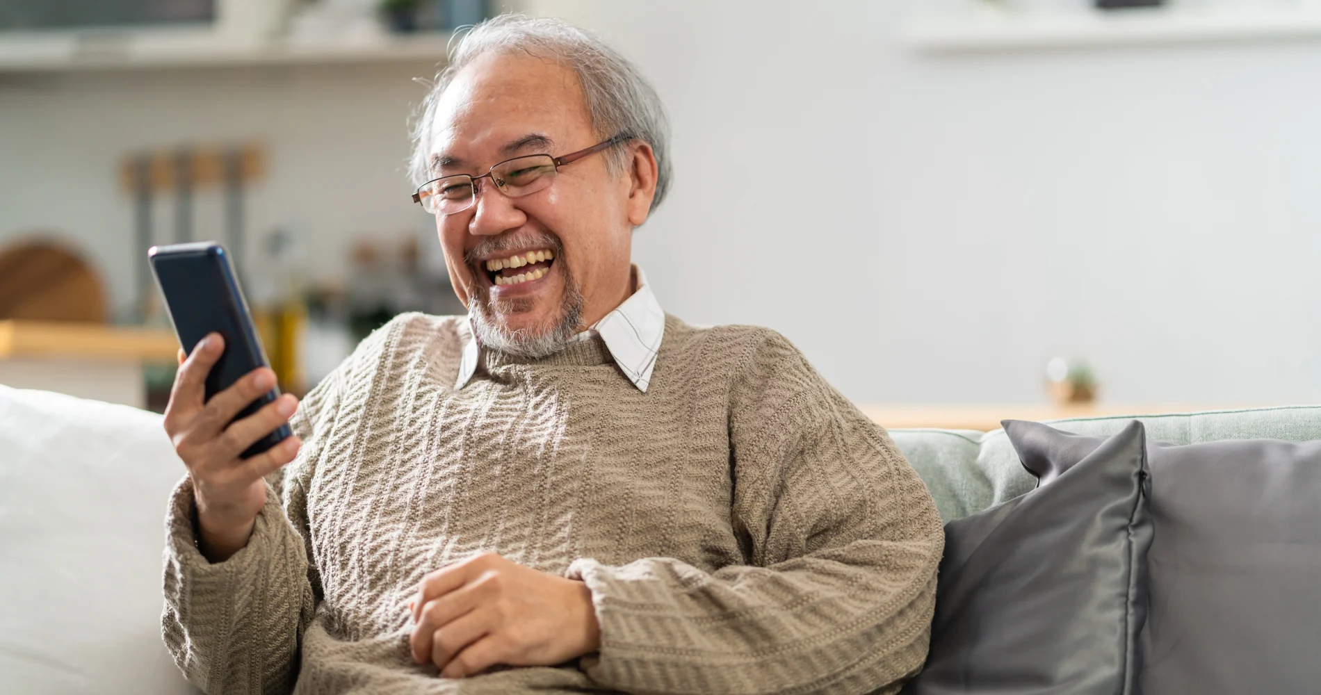 Senior man watching TELUS Optik TV for Business