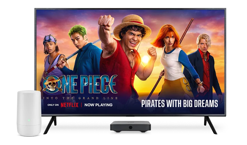 A TV, digital box and TELUS modem. The TV screen displays the poster for One Piece: Into the Grand Line.