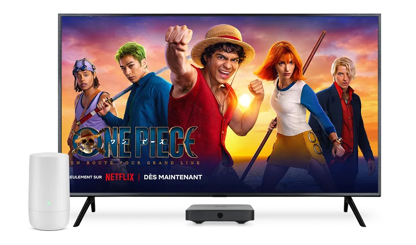 Un téléviseur, un décodeur numérique et un modem TELUS. L'écran du téléviseur montre l'affiche de One Piece : Into the Grand Line.