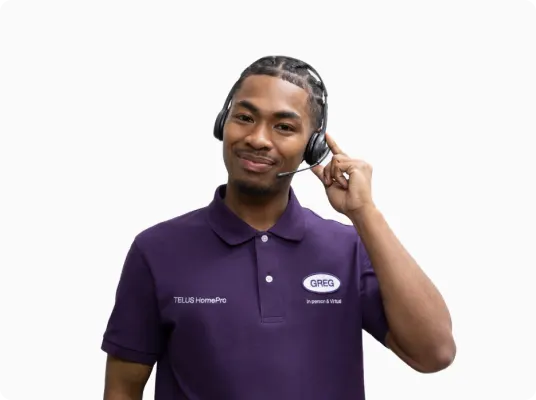 A TELUS HomePro expert taking a customer call using a headset.