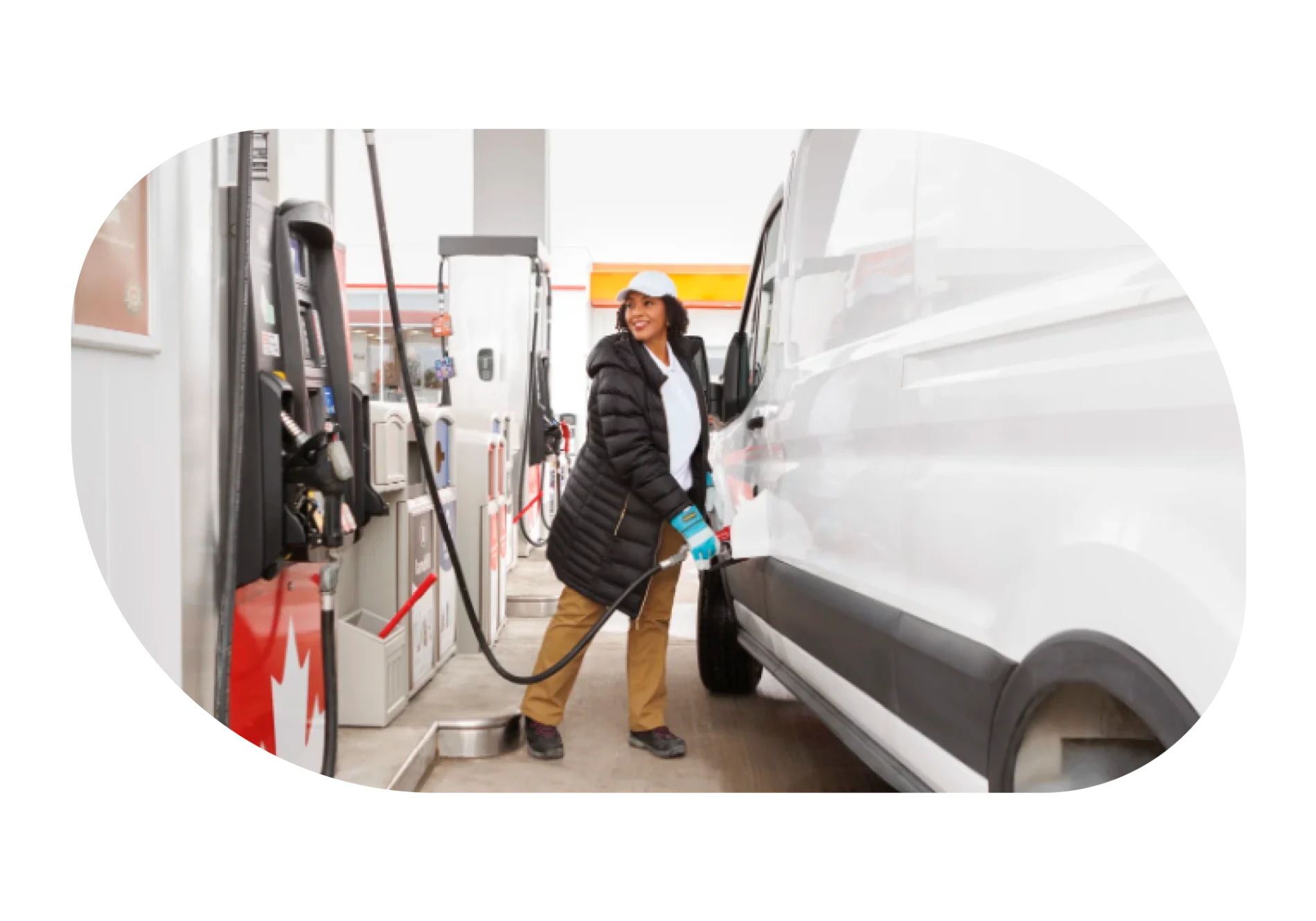 A female driver is refueling her vehicle with gasoline.