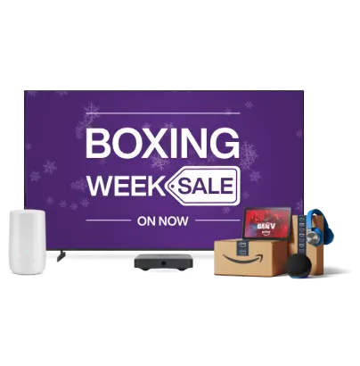 A TV, TELUS modem, tablet and Amazon parcels. The TV screen displays a text “BOXING WEEK SALE on now”.