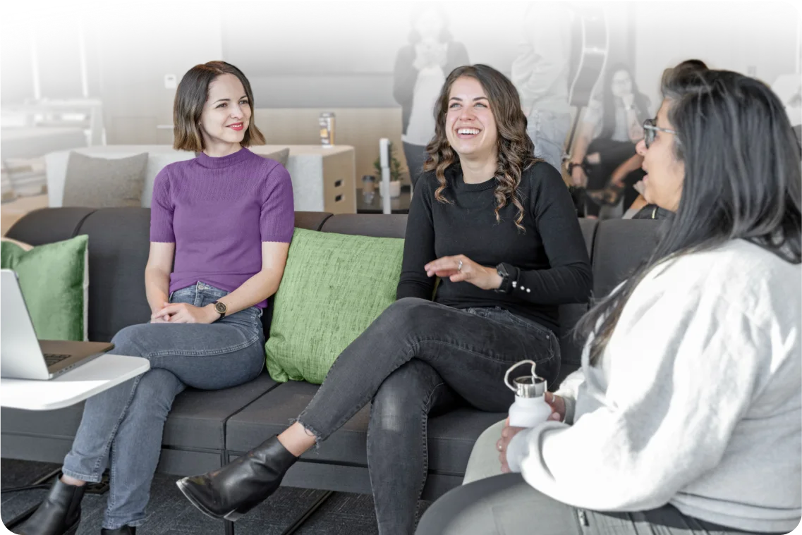 A group of adults working together in a conference room