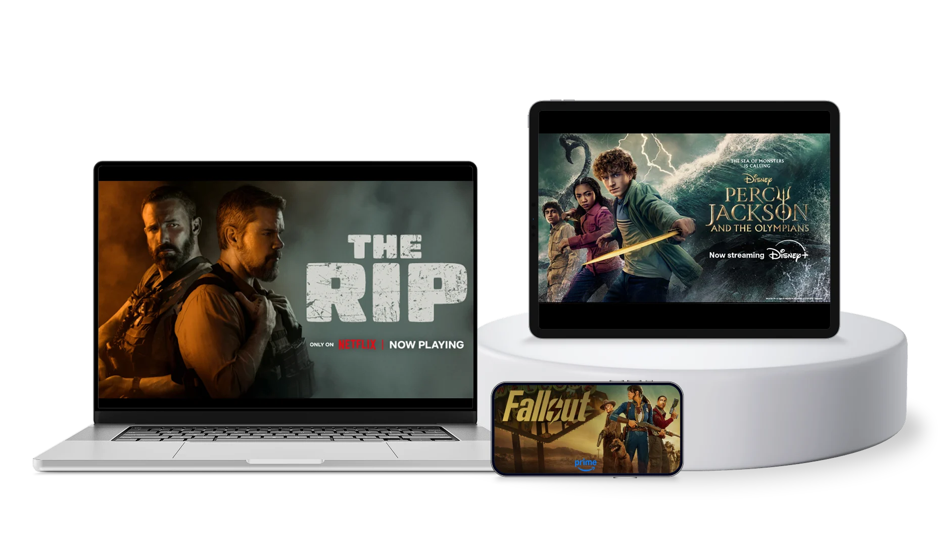 A laptop, tablet and smartphone. The devices display posters for The Rip, Percy Jackson and The Olympians and Fallout.
