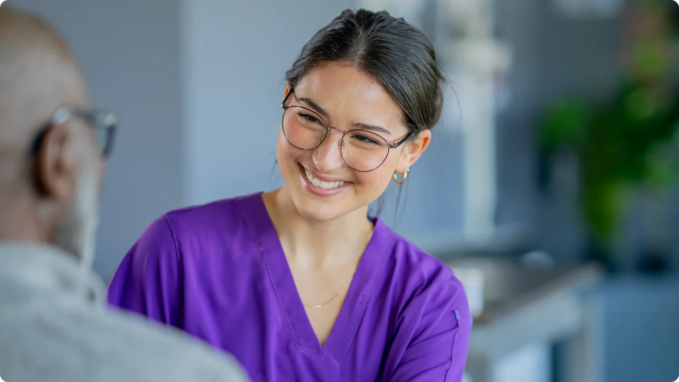 Allied health care professional consulting a patient