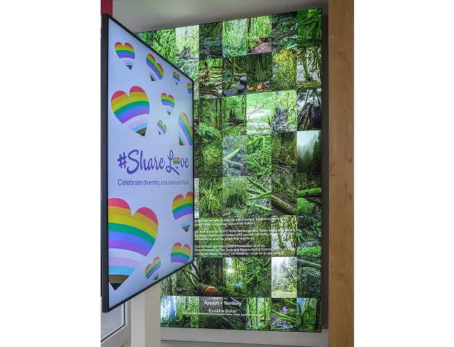 Image of lightbox inside TELUS store with collage of photography from artist Squamish Nation artist Eyoälha Baker