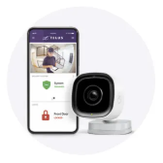 Phone with TELUS SmartHome Security app on screen and indoor camera beside it