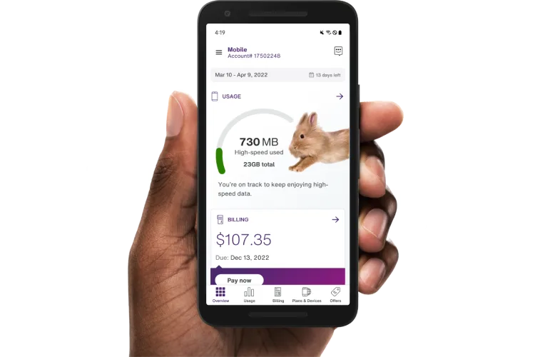 A hand holding a smartphone with the My TELUS app on the screen.