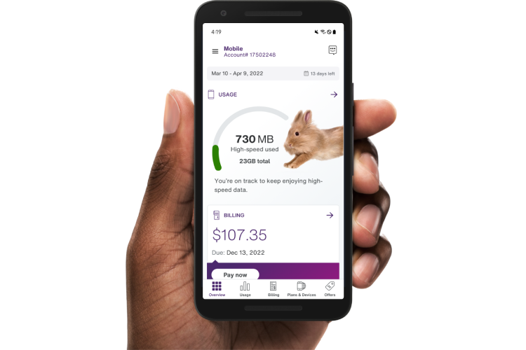 A hand holding a smartphone with the My TELUS app on the screen.