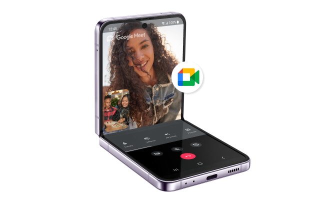 Angled view of a Samsung Galaxy Z Flip4 displaying a Google Meet video conference next to the Google Meet logo.