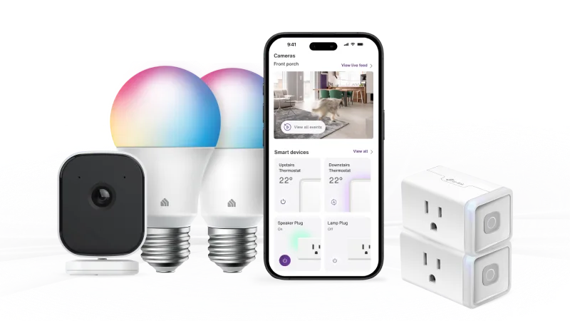A smartphone displaying SmartHome+ app surrounded by a security camera, smart bulbs and plugs.